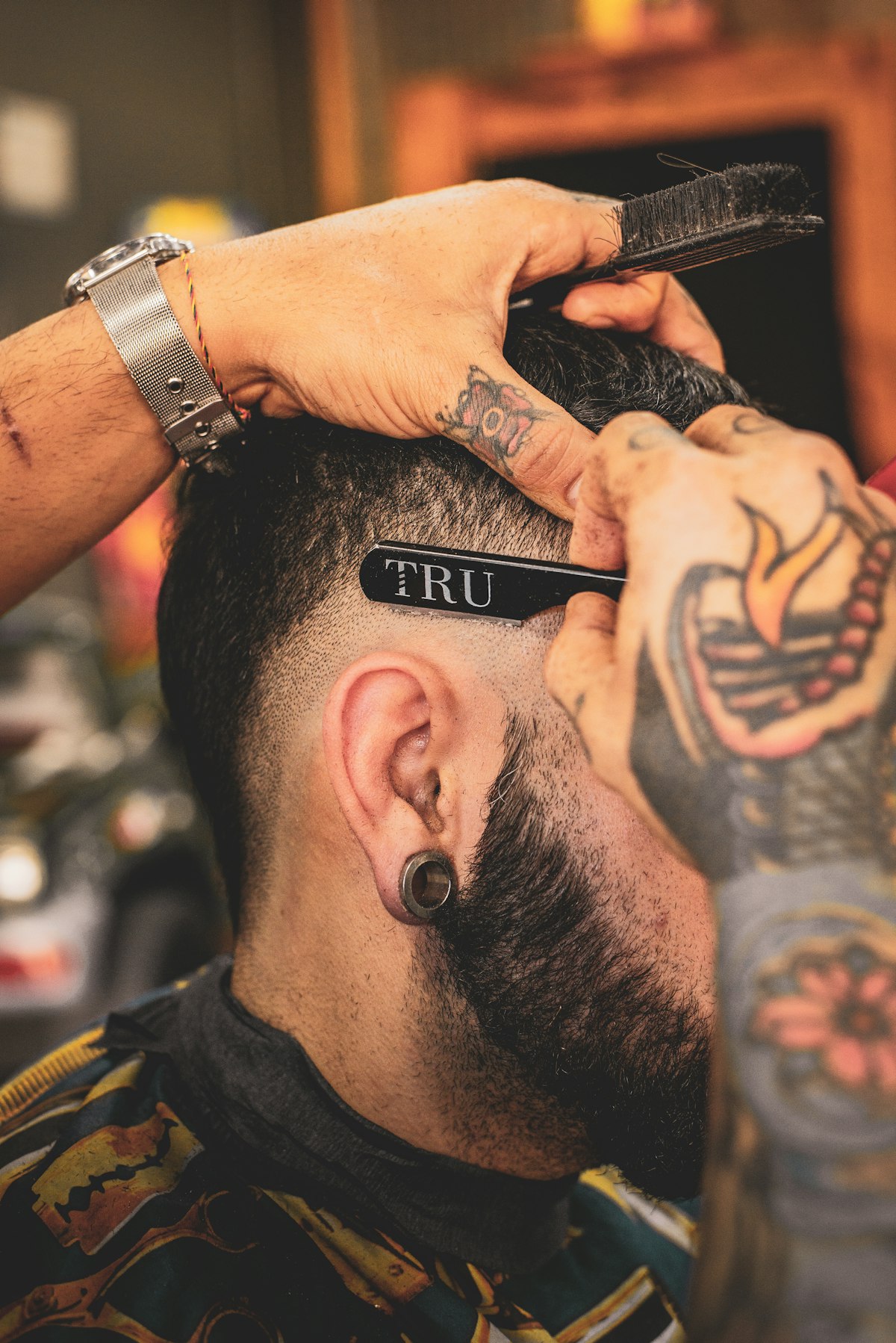 Barber finishing a haircut